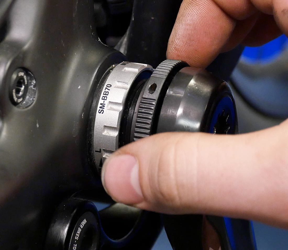 Closeup of Shimano® preload ring without pinch bolt on installed crankset