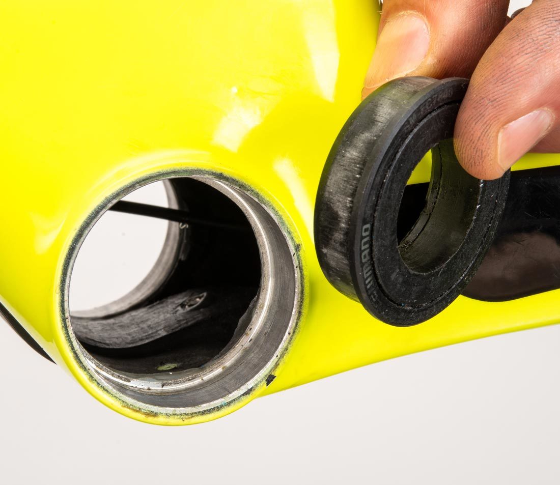 PF41 press fit bearing held next to bicycle frame with compatible bottom bracket shell