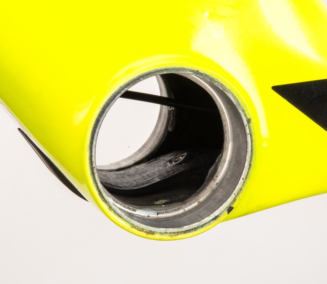 Empty PF41 press fit bottom bracket shell on a yellow bicycle frame