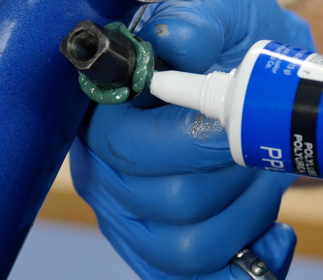 PPL-1 tube squeezing green poly grease onto bearing surface of bottom bracket spindle