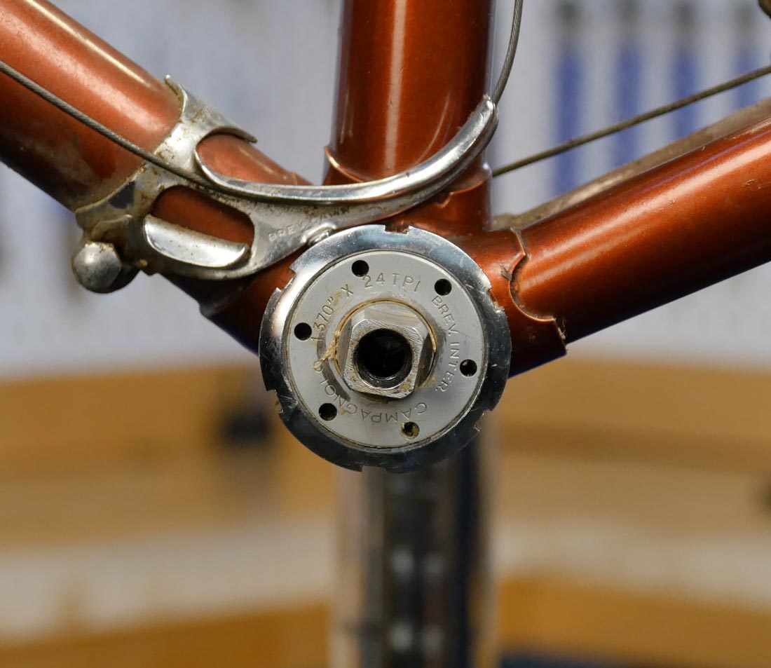 Adjustable cup bottom bracket lockring with 6 external notches, installed in bottom bracket shell