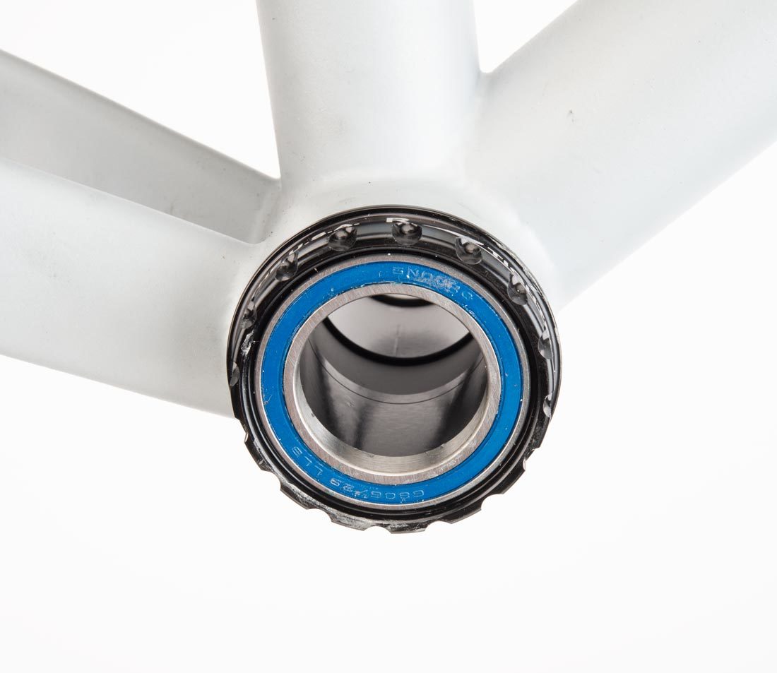 Threaded bottom bracket cup with 16 external notches, installed in bottom bracket shell on gray alloy frame