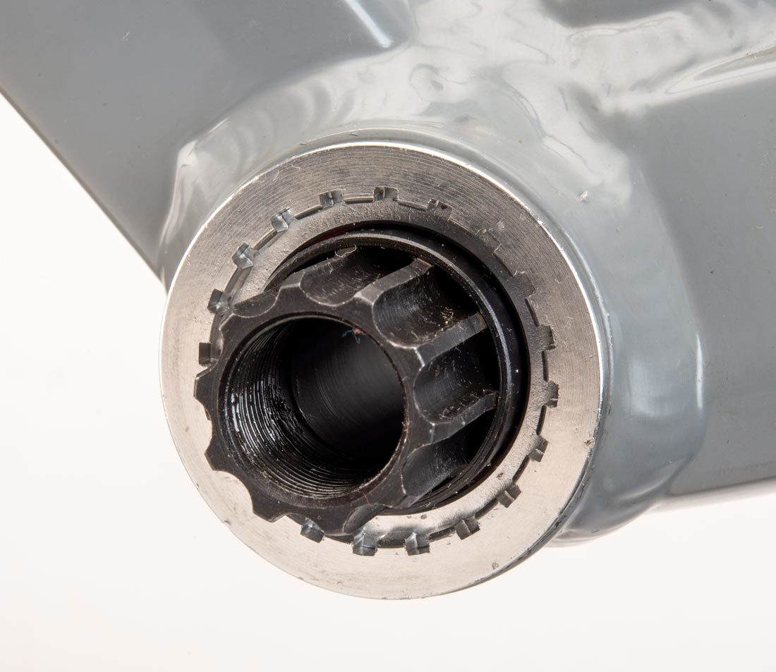 Cartridge bottom bracket with 22 internal splines, installed in bottom bracket shell on gray alloy bike frame