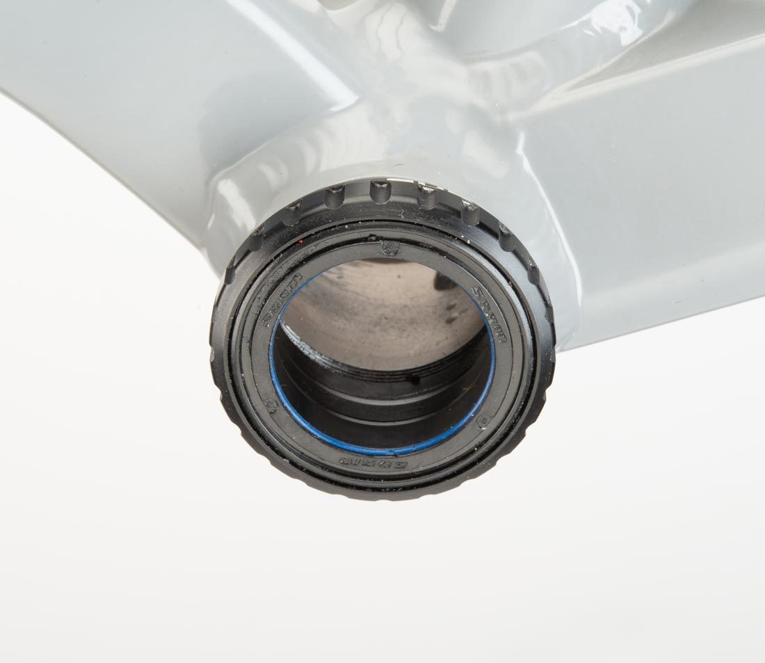 SRAM® DUB® bottom bracket cup with 24 external notches, installed in bottom bracket shell on gray alloy frame
