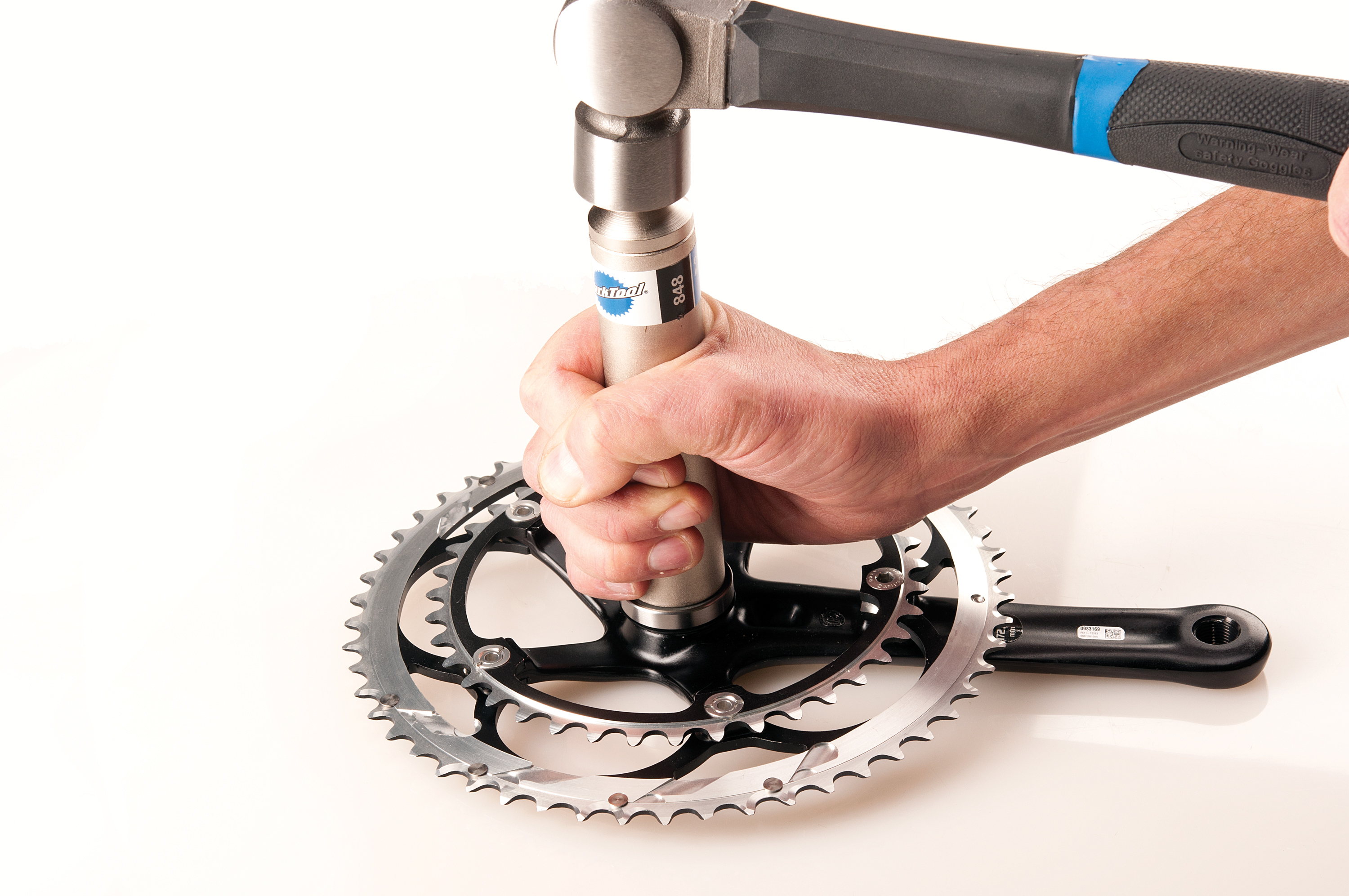 Drive bearing fully onto spindle with repeated impacts