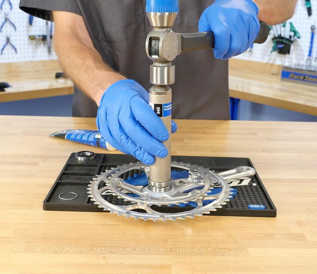 Hammer driving bearing onto drive side crank spindle using CBP-8 bearing driver