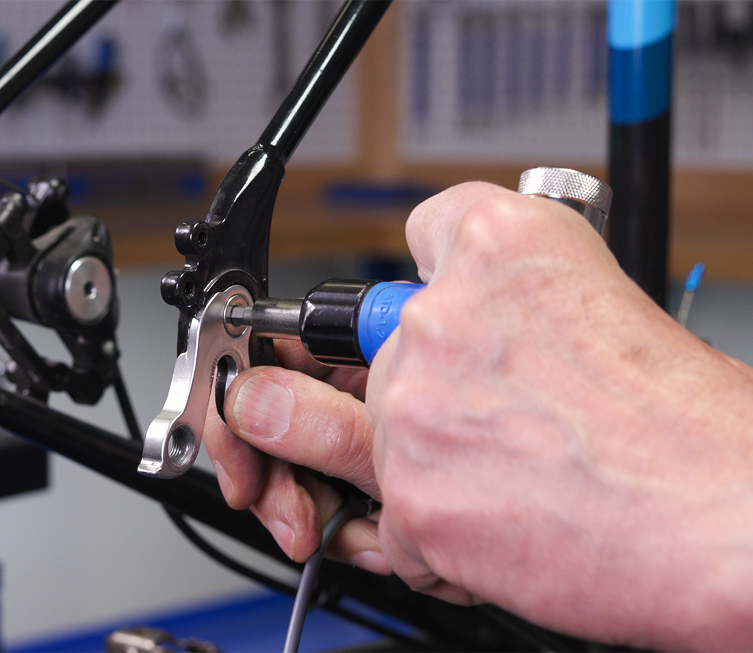 This example uses a larger mounting bolt — torque should be verified using a torque driver