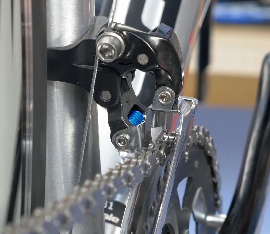 Wound spring inside mechanical front derailleur