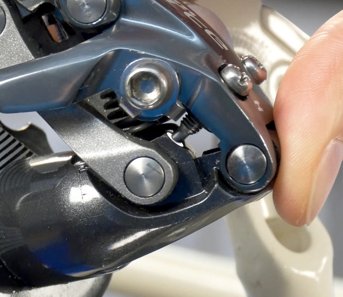 End of limit screw striking linkage