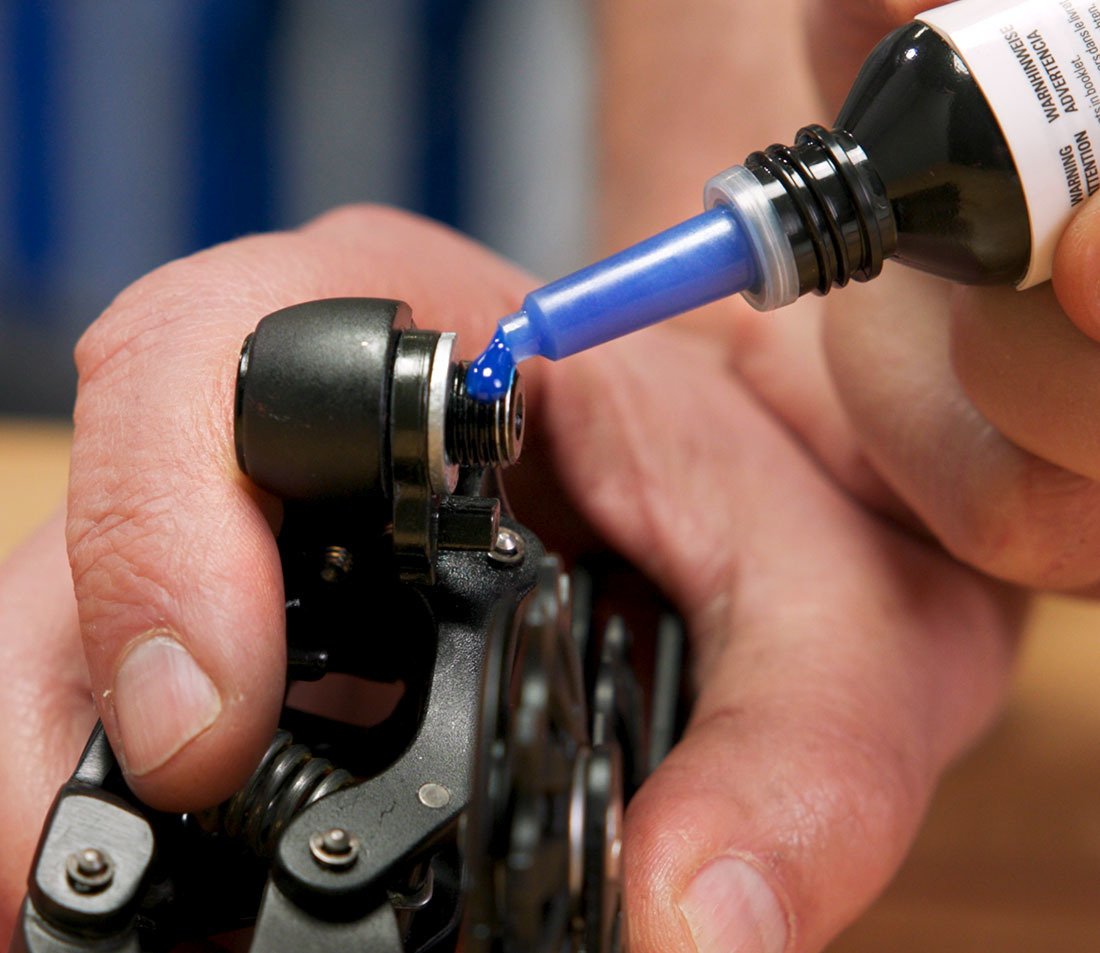 Apply a few drops of mild threadlocker to the threads