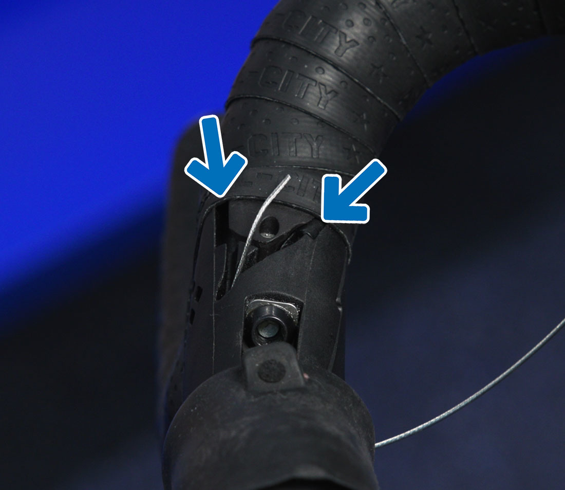 On this lever, the cable can be routed one of two ways. We can see the housing end cap on the left, so we route the cable there
