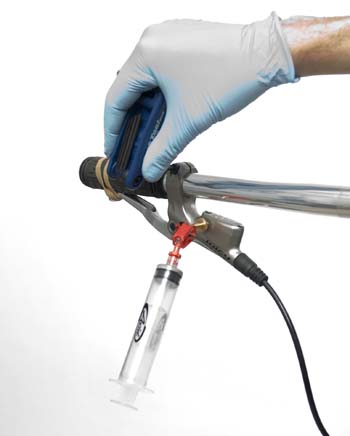 Figure 3. Align lever vertically, attach syringe, and strap lever closed to bar