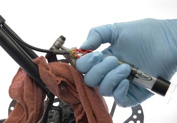 Figure 6. Close tubing clip at syringe