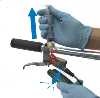 Figure 7. Pull back on plunger and tap body to free any air inside lever