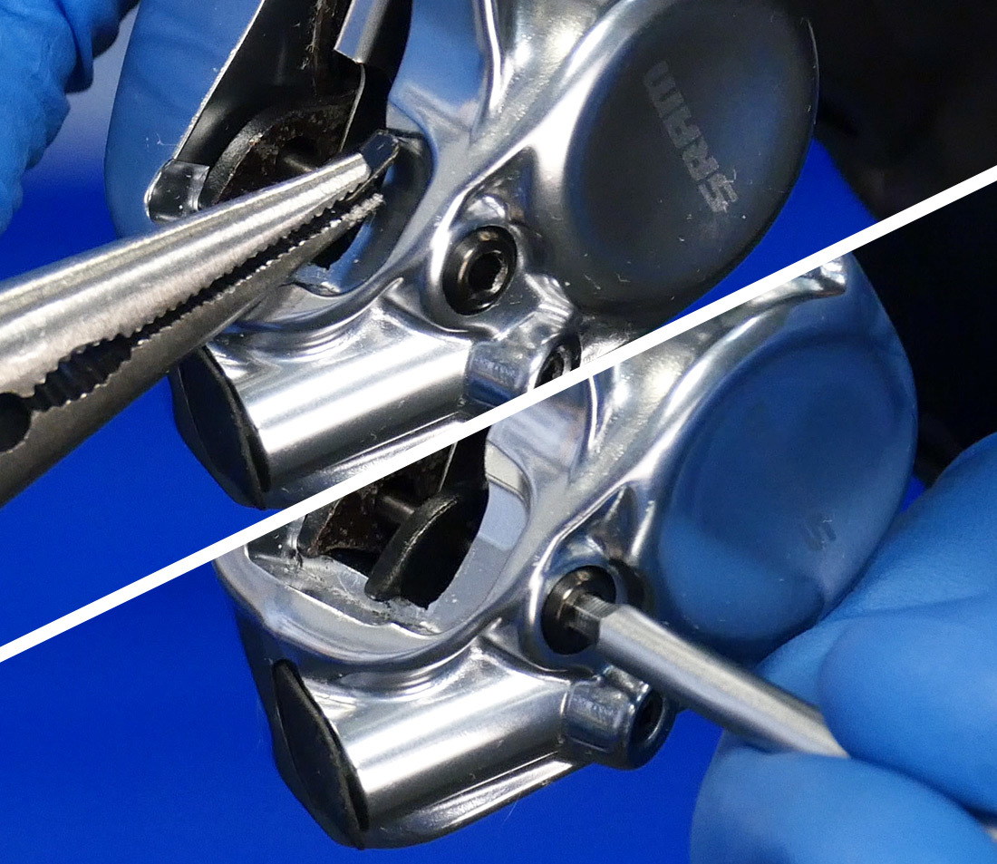 Removing clip and unthreading pin from hydraulic brake caliper with threaded pin