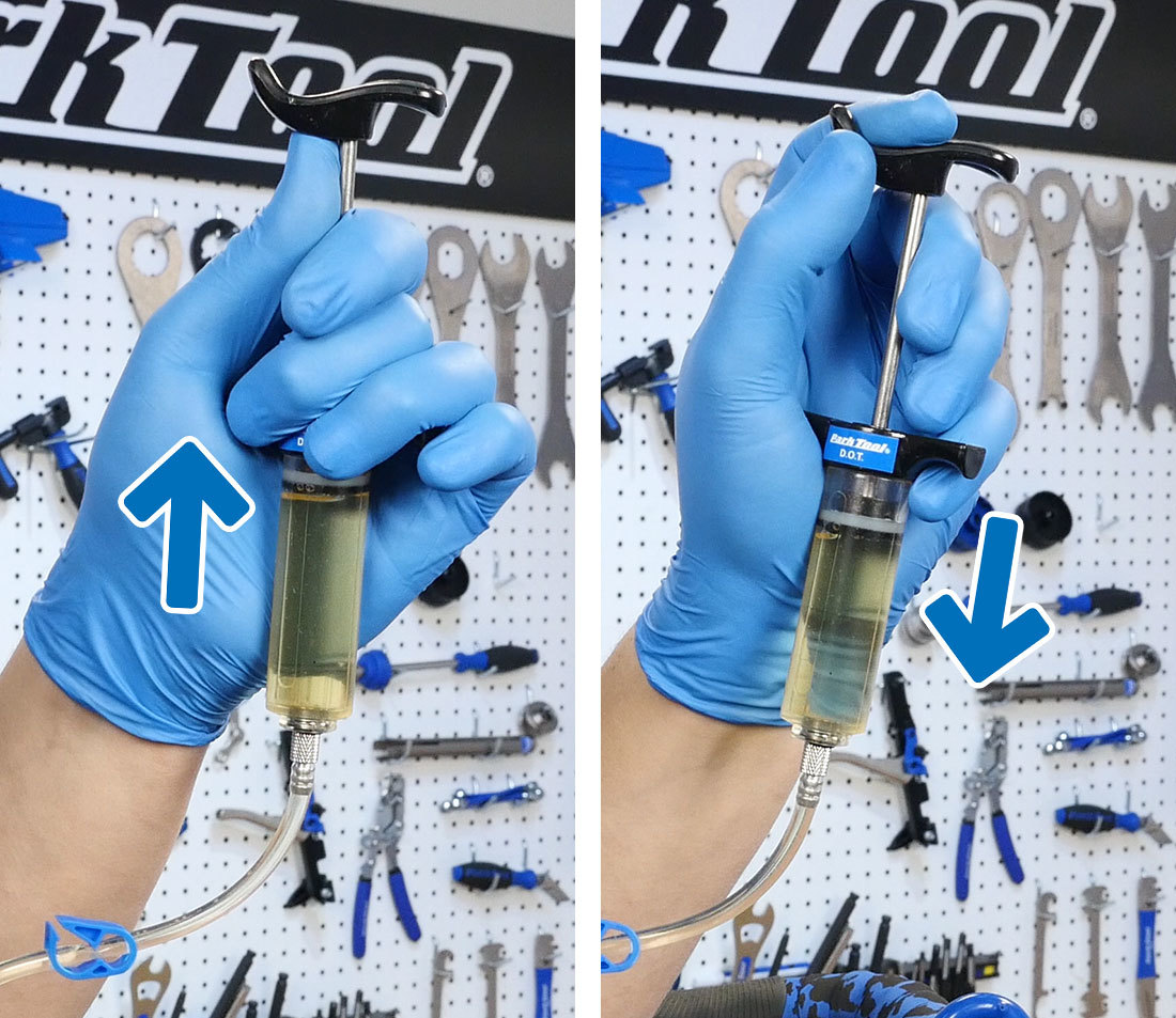 Bleed syringe being held in hand and the plunger pulled, then pushed