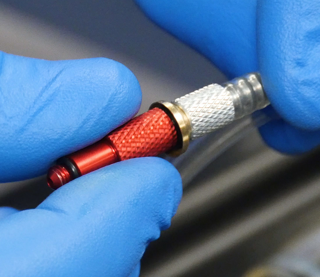 Finger threading adaptor #2618 onto syringe hose