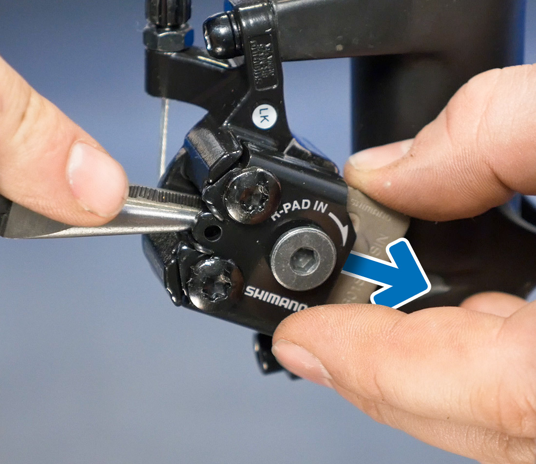 For this design, pads are removed out the bottom of the caliper