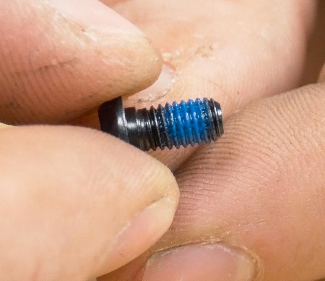 Rotor bolt with pre-applied threadlocker