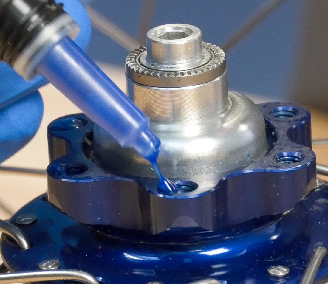 If needed, apply a single drop of threadlocker inside the mounting holes and wipe away the excess using a clean rag