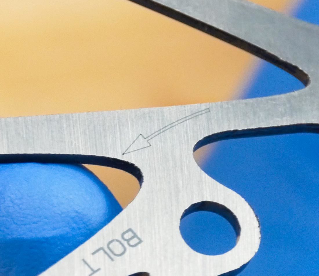 Any arrow on the disc should match the direction of wheel rotation