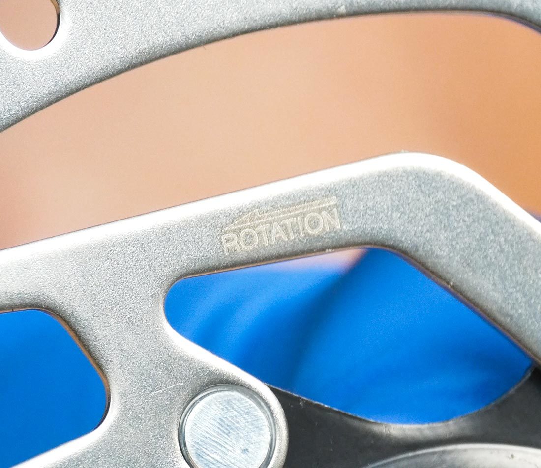 Any arrow on the disc should match the direction of wheel rotation