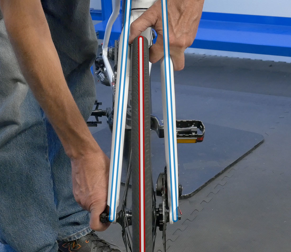 Wheel that is misaligned in the dropout — loosen and re-seat
