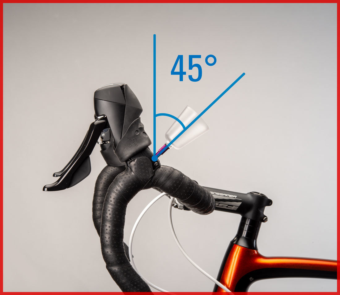 Bleed funnel installed into brake lever, with drop handlebars rotated so funnel is 45 degrees from vertical
