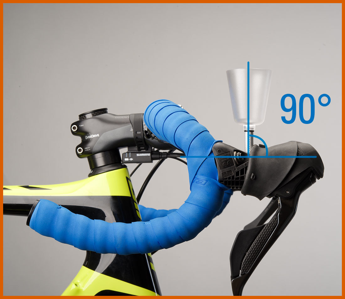 Bleed funnel installed into brake lever with drop handlebars rotated so the funnel is 90 degrees vertical