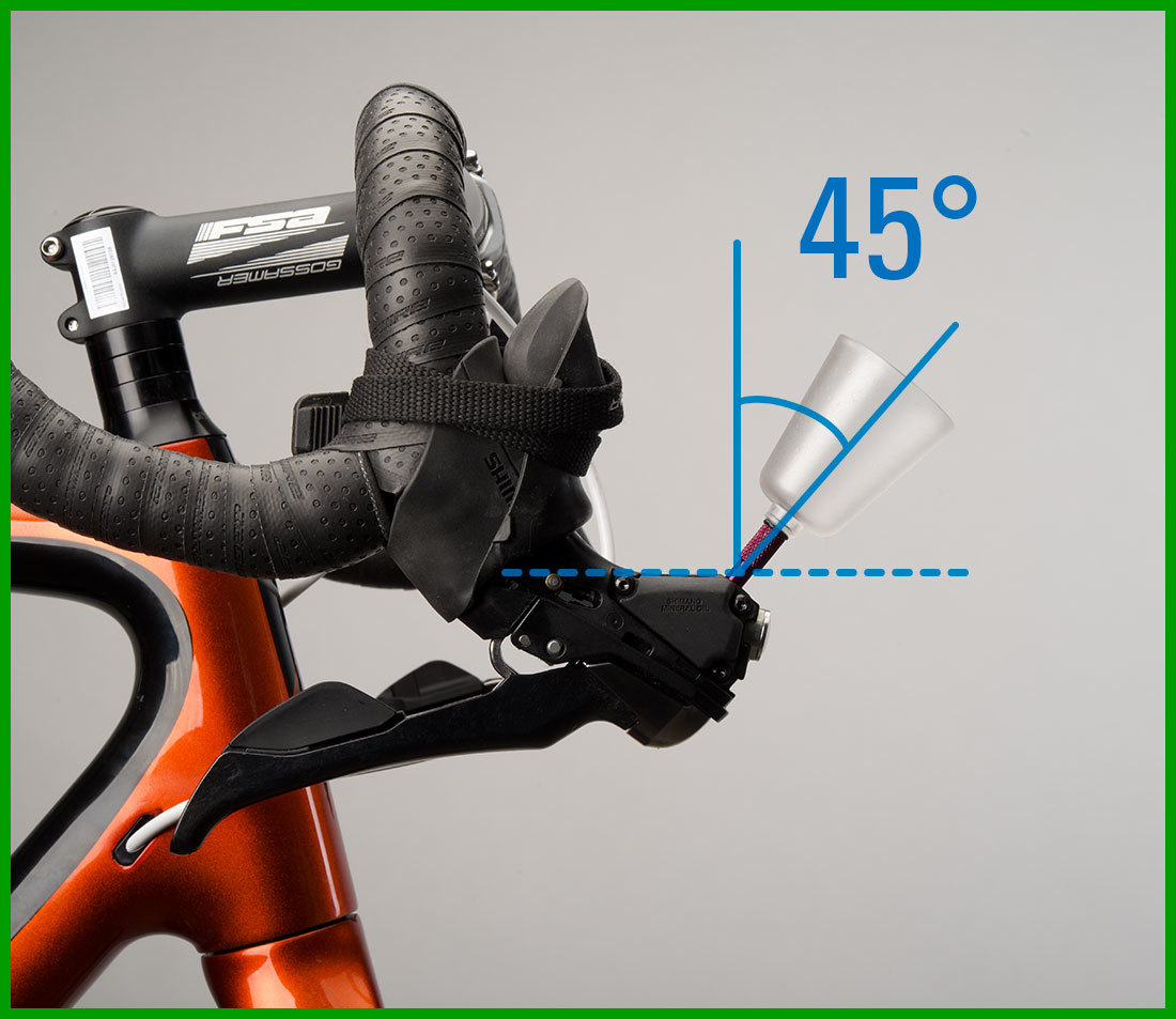 Bleed funnel installed into brake lever with drop handlebars rotated so funnel is 45 degrees from vertical