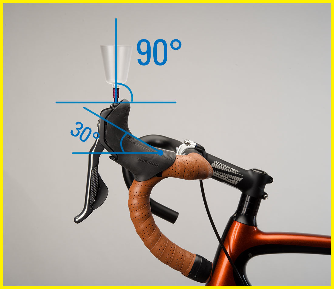 Bleed funnel installed into brake lever with drop handlebars rotated so funnel is 90 degrees vertical