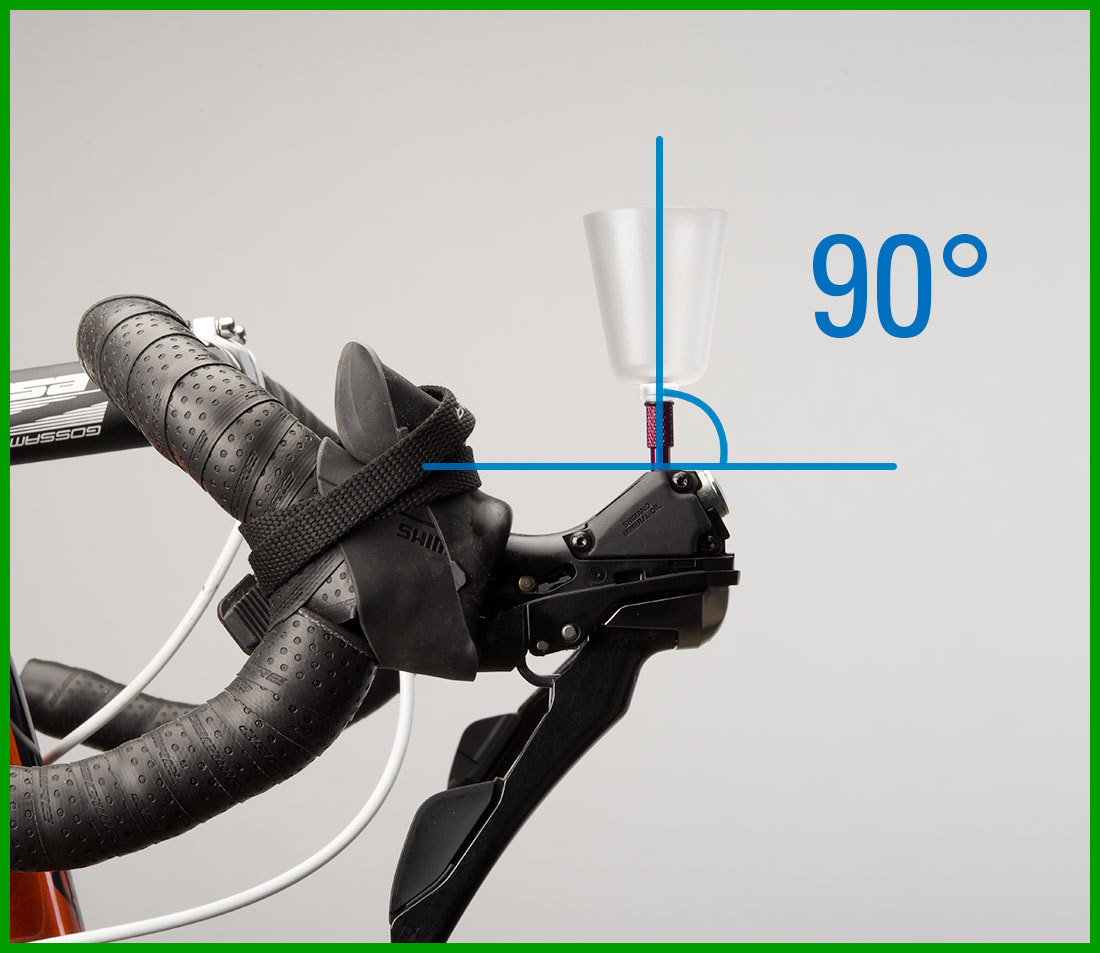 Bleed funnel installed into brake lever with drop handlebars rotated so funnel is 90 degrees vertical