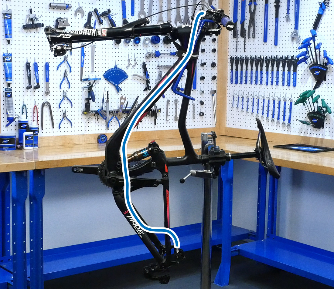 On rear brakes, the bike may need to be tilted. Lower the stand if necessary.