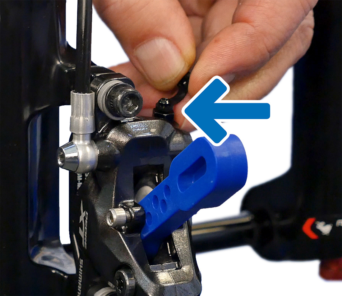This caliper bleed nipple is located on top of the caliper body