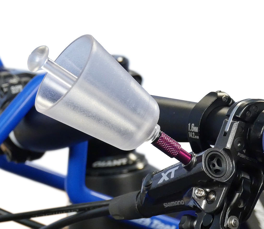 Bleed funnel (with adapter) installed into the bleed port