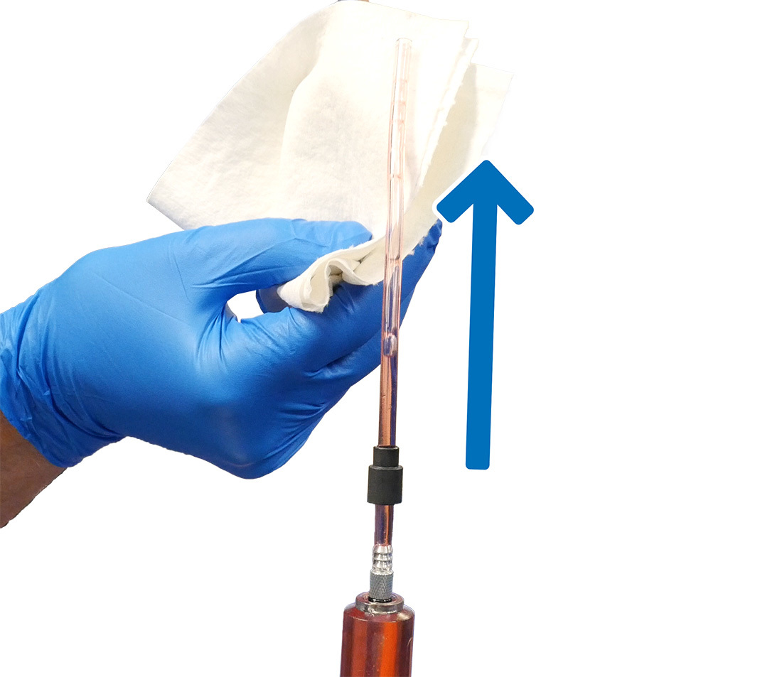 Clearing the syringe of air. Note the orientation of the compression sleeve.
