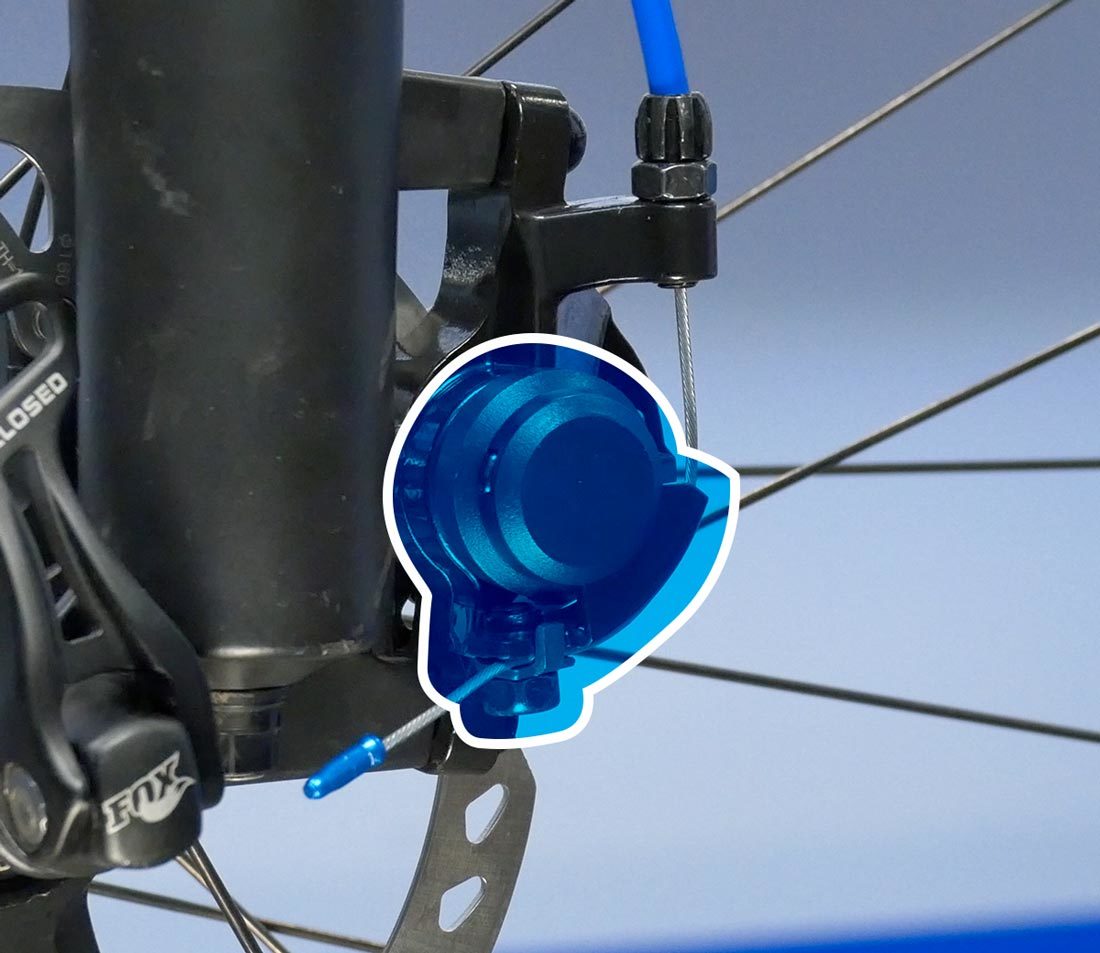 The cable pulls a single arm, which moves the outer pad