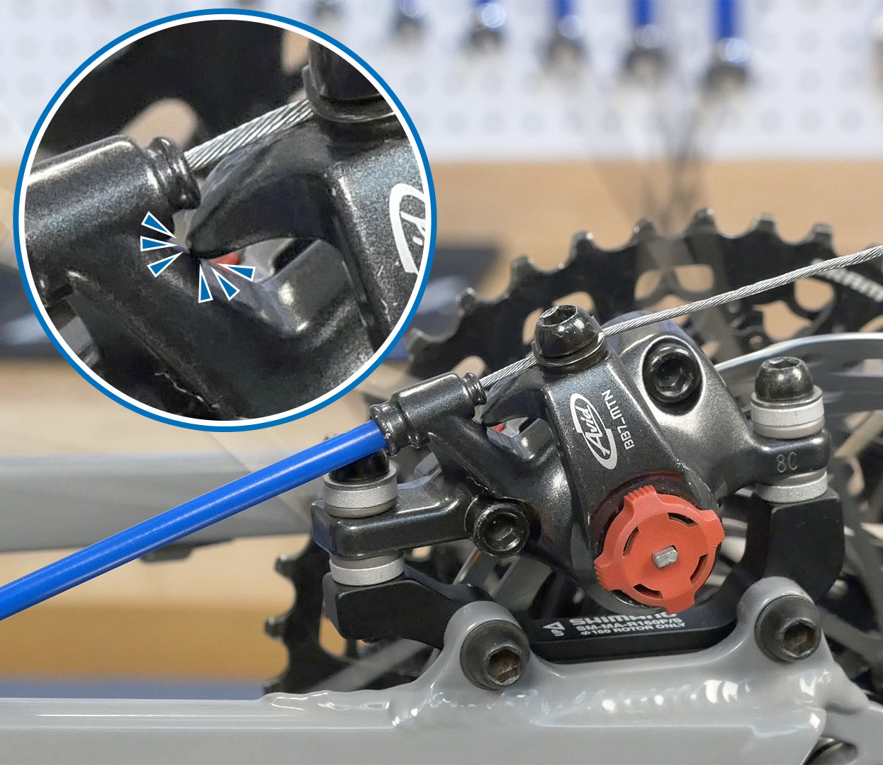 On this caliper, the barrel adjuster was used to compensate for worn brake pads. As a result, when the brake is engaged the lever arm contacts the caliper body before the pads meet the rotor, resulting in *NO BRAKES*