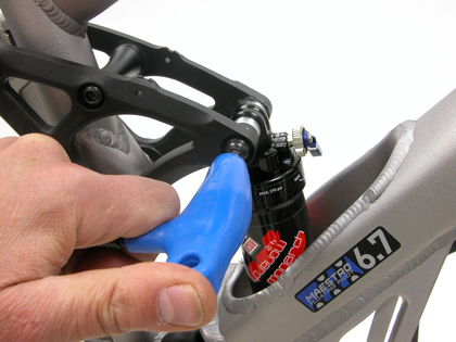 Figure 2. Remove bolts from upper and lower shock eyelets