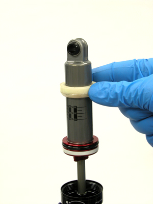 Figure 11. Slide the negative spring bumper up and off damper