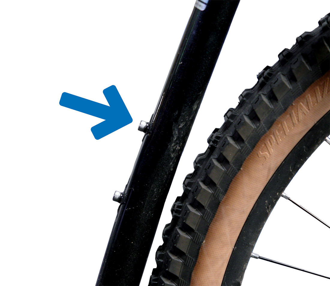 Detail shot of a bicycle frame seat tube, with an arrow pointed to the top bottle cage bolt.