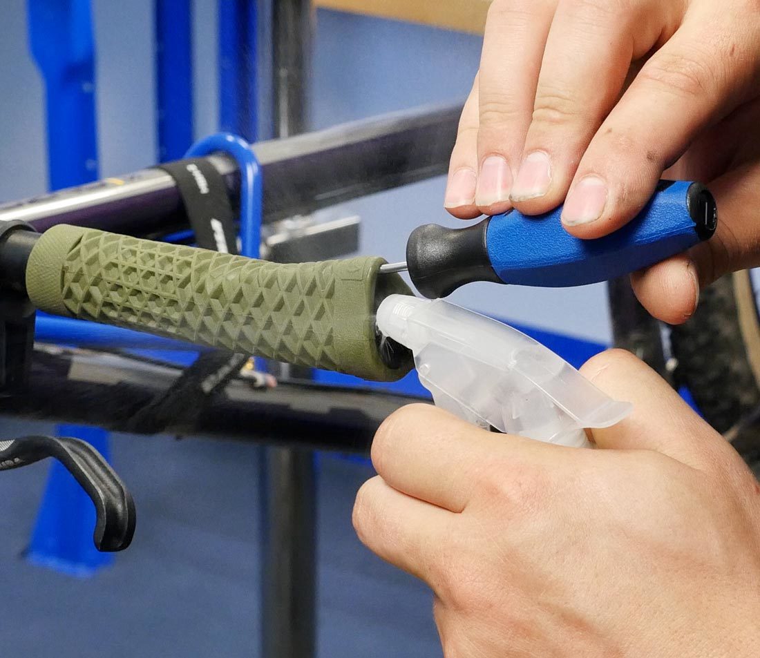 Inject alcohol between the bar and grip using a spray bottle