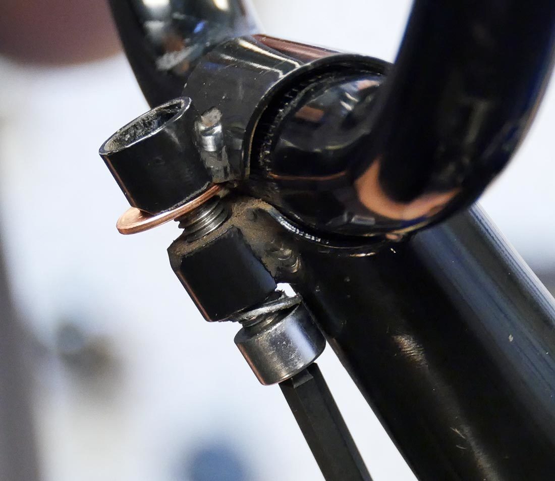 Push open the compression slot using a coin and bolt