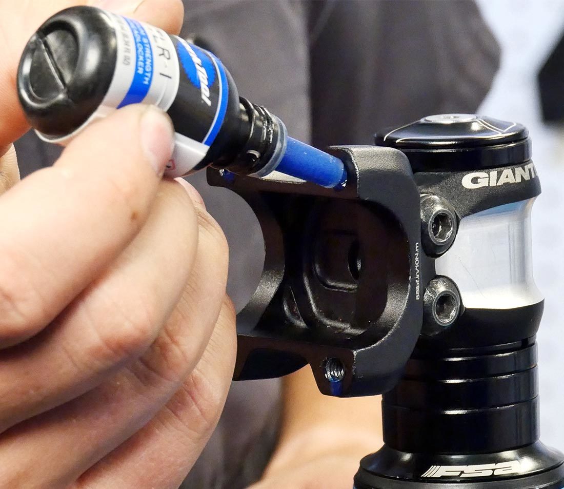 Apply grease or threadlocker to the bolts or bolt holes