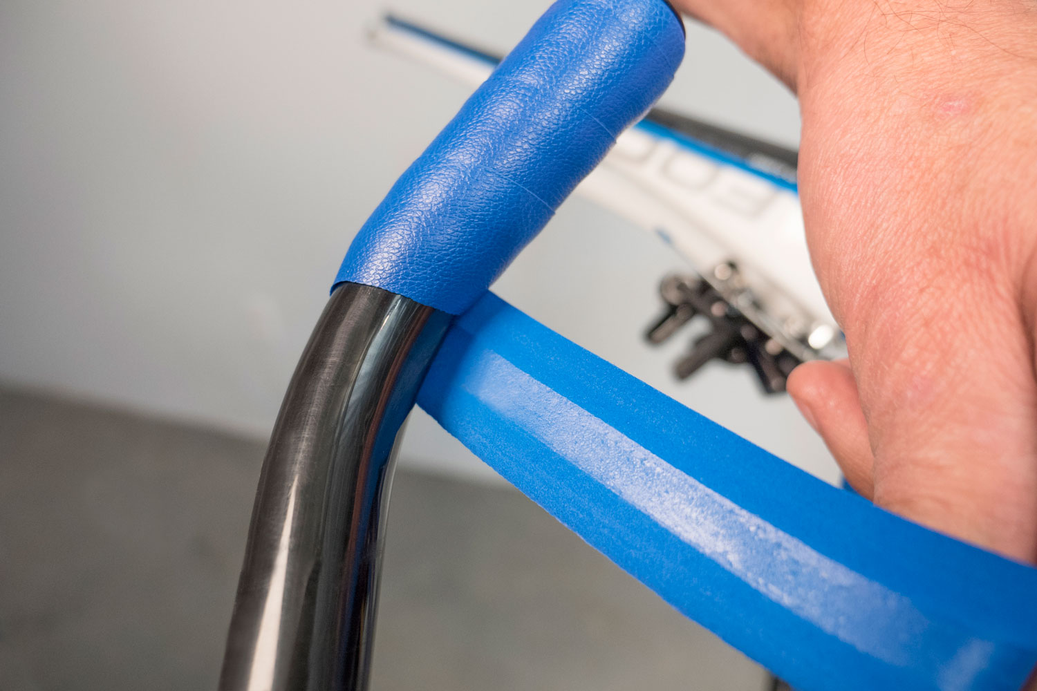 Overlap with adhesive strip on bare handlebar