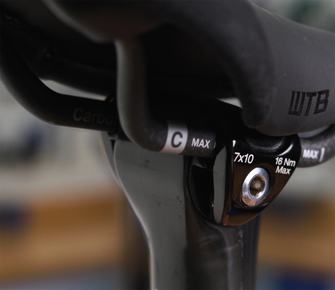 Saddle with oval carbon fiber rails. Note that the seatpost clamp denotes compatibility with 7x10 mm rails.