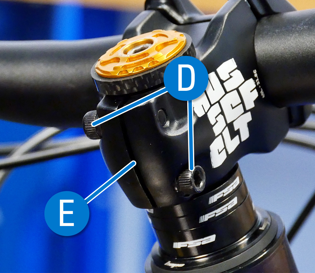 Pinch bolts (D) and Compression Slot (E)