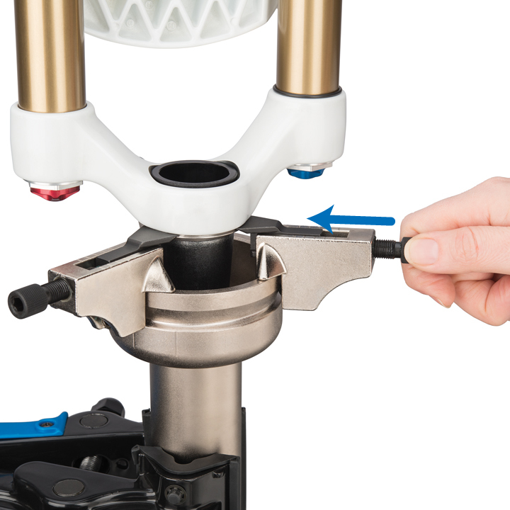 Figure 6. Snug plunger bolts evenly to place blades between race and crown