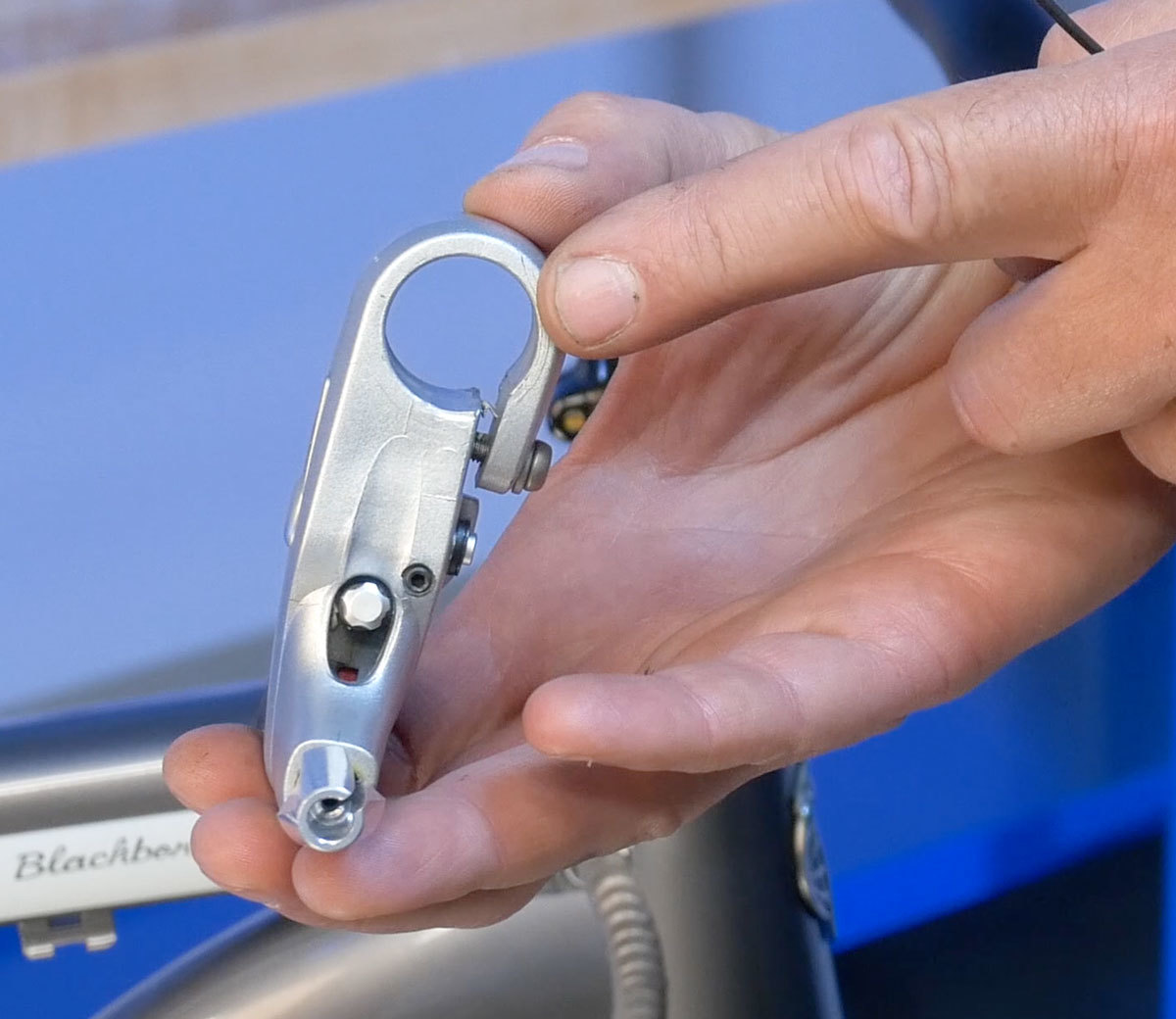 Compression slot in body of brake lever