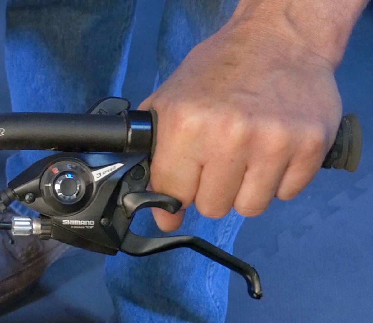 Lever laterally set too far outward and interfering with hand placement